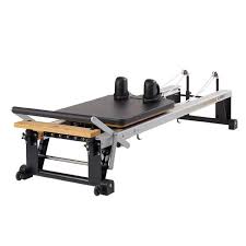 At Home Pilates Reformers Stott Pilates Merrithew Com Pilates At Home Pilates Reformer Yoga Studio Home