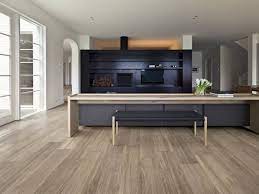 Using checkerboard tiles sparingly to define the kitchen space is another great way to bring this classic look into the 21st century! Wood Tile Flooring Deck