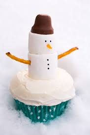 Snowman Cupcakes Cooking Classy Vanilla cupcakes vanilla frosting white sugar sprinkles chocolate chips, both mini and regular size gummy orange slices. snowman cupcakes cooking classy