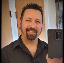 What is the history and significance of the coin ceremony and tap out at  Lackland Air Force Base basic training graduation?