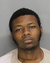 Diddy's mother gives a thumbs up while leaving the courthouse