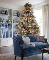 Adorn your christmas home with this green christmas tree dressed up using cream ribbon, silver and gold ornaments with flowers. 35 Frosty Blue And White Christmas Decor Ideas Digsdigs