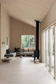 Peek Inside A Minimal Getaway In Sweden A Warm Wood Interior With Wood Clad Walls Ceiling And Floor A Wrap In 2020 Contemporary Cabin Cabin Interiors Cabin Design