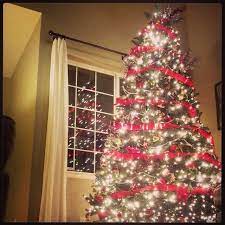 Red Ribbon Garland Wrapped Around A 9foot Christmas Tree Silver Bead Garlan Christmas Tree Ribbon Garland Ribbon On Christmas Tree Bead Garland Christmas Tree