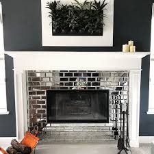 Mosaic tile over brick fireplace. Shop Reflection Revere Mirror Tile Design On Tilebar Glass Tile Fireplace Fireplace Design Brick Fireplace Makeover