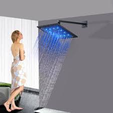 A traditional rain shower head with the identical body style as our classic but with the popular dimpled face construction instead of individual cast brass nozzles. 12 Inch Led Matt Black Rain Shower Head With Shower Arm Wonderland Shower Inc