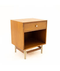 Two sloped, openwork metal legs with a brass finish support the wooden structure that featur. George Nelson Style Kroehler Signature Line Mid Century Walnut Rosewood And Metal Nightstand