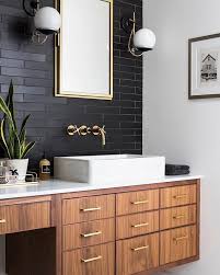 A Twist On The Classic Subway Tile In This Bathroom Black Long And Skinny Subway Tile With Black Black Tile Bathrooms Black Bathroom Bathroom Interior Design