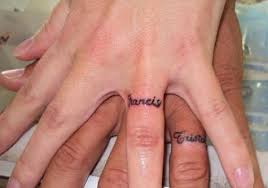Name tattoo is a simple tattoo that has a name in it. 9 Wedding Ring Tattoos Ideen Und Designs Fur Manner Und Frauen Barbaramode Com Tattoo Wedding Rings Him And Her Tattoos Ring Finger Tattoos