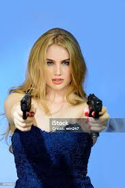 Hot Blonde Woman With Two Guns Aimed At You Stock Photo - Download Image  Now - 2015, Adult, Aiming - iStock
