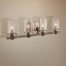 Sconces are the most common fixture, here are the best you are looking at a ton of chrome and brushed nickel, because they match the most popular faucets and hardware. Bridlewood 31 Wide Brushed Nickel 4 Light Bath Light 47h21 Lamps Plus