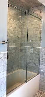 Frameless Barndoor Style Sliding Door And Stationary Panel With Stainless Steel Hardware Glass Shower Enclosures Shower Enclosure Glass Shower