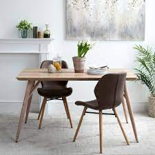 When shopping for dining tables for small spaces, consider options with a relatively small surface area or one with a favorable shape that can be pushed to one side or accommodate multiple people. Kaminly Small Dining Table