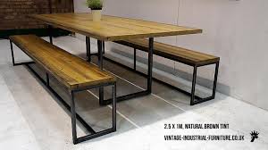 6 to 8 seater table with reclaimed wood top. Industrial Loop Leg Dining Table