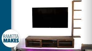 Cabinet mounts to wall with either the metal hanging brackets attached or through holes drilled in the interior corner blocks, with your mounting hardware. How To Build A Tv Wall Unit With Leds And Built In Wireless Charger Diy Youtube