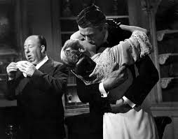 Alfred Hitchcock sneezing while Ingrid ...