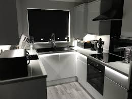 Modern Grey Kitchen Howden S Clerkenwell High Gloss Dove Grey With Grey Glass Effect Wo Open Plan Kitchen Living Room Modern Grey Kitchen New Kitchen Designs