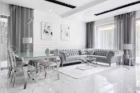 While the bedroom is your. Charming And Luxury Living Room In Gray And White With Glass Stock Photo Picture And Royalty Free Image Image 132364709