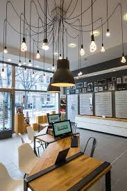 an eight legged chandelier in marseille eyewear store design shop interiors shop interior design