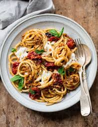 Thick Hollow Bucatini Pasta Sauced With Creamy Burrata Cheese And Sicilian Almond Pesto A Robust Savory Sauce With Toasted Almonds Dried Tomatoes And Basil