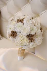 Summer wedding real weddings all white wedding real weddings photos blush and gold wedding color palette wedding wedding photos janelle's wedding bouquet contained gorgeous white orchids and greenery. Wedding Wednesday Bouquets Of White And Gold Flirty Fleurs The Florist Blog Inspiration For Floral Designers