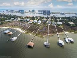 Ono home with adjoining extra lot for guest home, expansion, or privacy.located on part of an extraordinary private gated island community, this singular property across two separate lots. Build Your Dream Home On Ono Island Alabama Gulf Coast Real Estate Coldwell Banker Coastal Realty