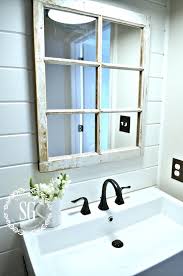 A farmhouse bathroom decor might include a cute vintage window panel which doubles as a towel holder. Design A Farmhouse Inspired Bathroom On A Budget Homegoods
