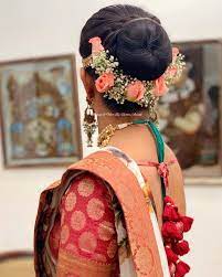 Bridal Hair Bun With Fresh Roses Hairstyle By Mua Vejetha Anand For Swank South Indian Bride Brida Bridal Bun Couture Bridal Shower Indian Bridal Hairstyles