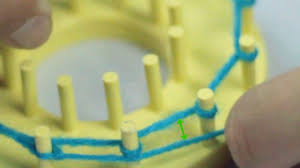 Before long, you'll be purling up a storm. How To Purl Stitch On A Round Knitting Loom 7 Steps