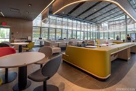 Counter area, kitchen and menus are visible in wide angle view in interior of mcdonald's. Photos A Look At The New Walt Disney World Solar Powered Mcdonald S