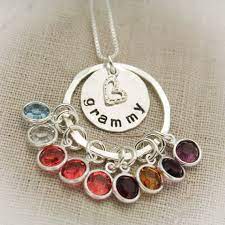 We carry a number of birthstone jewelry, from cage lockets to our custom heart and cross necklace. Grandmother Necklace Sterling Silver Hand Stamped Personalize Etsy Metal Stamped Jewelry Stamped Jewelry Grandmother Necklace