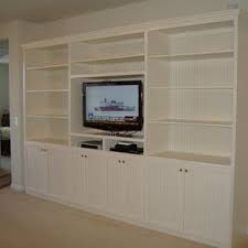 The whole, in white, presents itself stylishly and modernly and does not overwhelm the decor. Built In Tv Wall Units Custom Built Wall Units Custom Made Built In Tv Wall Units Design Built In Wall Units Wall Unit Built In Tv Wall Unit