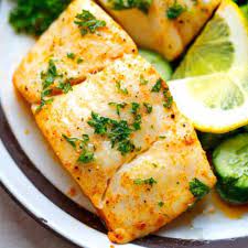 Baked Halibut Fillet On A White Plate Halibut Fillet Recipe Halibut Recipes Fish Recipes Baked
