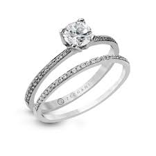 In 14k white gold (1/4 ct. 14karat White Gold Wedding Set 19d Beverlys Jewelers