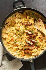 Vegan Creamy Cajun Pasta With Crisp Breaded Tofu Nut Free Creamy Cajun Spice Sauce With Farfalle And Breaded Tofu Creamy Cajun Pasta Breaded Tofu Cajun Pasta