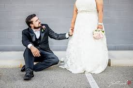 Groom Sitting Bride Standing A Bit Of A Different Wedding Pose Fun Wedding Pictures Wedding Poses Wedding Photographers