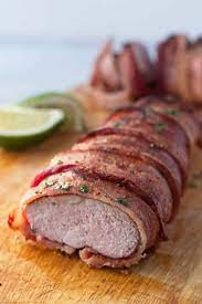 Mix the oil, thyme, rosemary, salt, pepper, and garlic powder in a bowl and toss the pork tenderloin in it. Traeger Bacon Wrapped Pork Tenderloin A License To Grill