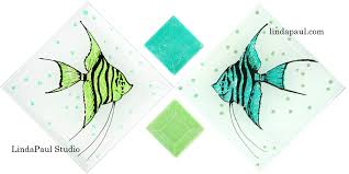 A collection of solid color glass tiles will inspire you to create a dreamline oasis that will beg you to come and be pampered. Fish Tiles In Blue And Green Sea Glass Colors Decorative Tiles