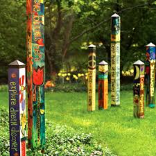 Concrete the peace pole post 24 into the ground in its hole, using a level on each side to make sure that it is plumb and level. Peace Garden 6 Art Pole 5x5