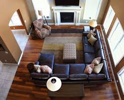 Sculptural wood tables complement leather side chairs and a gray upholstered sofa in a massachusetts living room design crafted by found design studio. Sensational Large Sectional Sofas Decorating Ideas For Living Room Transitional Design Sectional Living Room Layout Livingroom Layout Rectangular Living Rooms