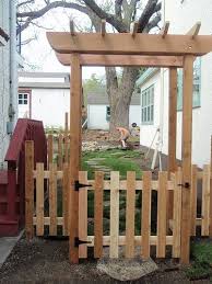 Garden arch with gate and fence. Simple Shape Of This Arbor Garden Gates And Fencing Garden Archway Garden Arbor With Gate