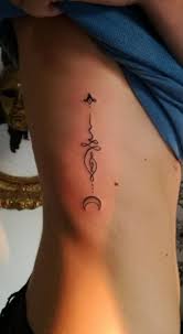 Other designs also have a spiritual aura and always motivate the person who wears them. Meaningful Unalom Tattoo Designs And Symbols Unalome Tattoo Rib Tattoos For Women Rib Tattoo