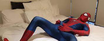 Guy in Spiderman's costume is playing with his hard cock - GotGayPorn.com