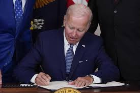 Joe Biden signing legislation
