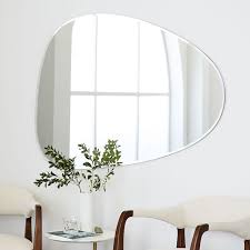 High Low Asymmetrical Decorative Mirrors Remodelista Wall Mirror Decor Living Room Mirror Wall Living Room Wall Decor Living Room