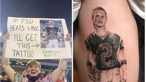 We are in the second building on the right. Meet The Fsu Fan Who Got Mike Norvell S Cornrows Tattooed On His Leg