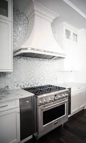 Artistic Tile I Dapper Daisy Mosaic In White Silver Illuminates This Backsplash With A Floral Arrange Interior Design Kitchen Metallic Backsplash Kitchen Hoods