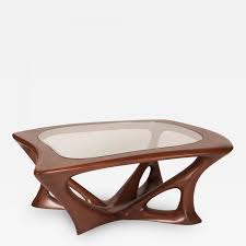 Deciding to purchase a quality amish hardwood coffee table is easy, but choosing that table takes a little more thought! Amorph Ariella Coffee Table Solid Wood Walnut Stained With Glass Top