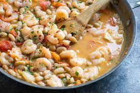 Recipe Spicy Shrimp Skillet With Tomatoes And White Beans Recipe Bean Recipes Spicy Shrimp Spicy Recipes