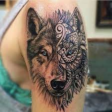 Realistic Looking Colored Shoulder Tattoo Of Wolf Head With Ornamental Mask Wolf Tattoos Tattoo Ideen Tatowierungen